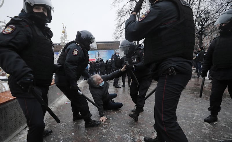 Russian special police units officers detain a protester during a protest in support of Russian opposition leader and blogger Alexei Navalny in Moscow. EPA