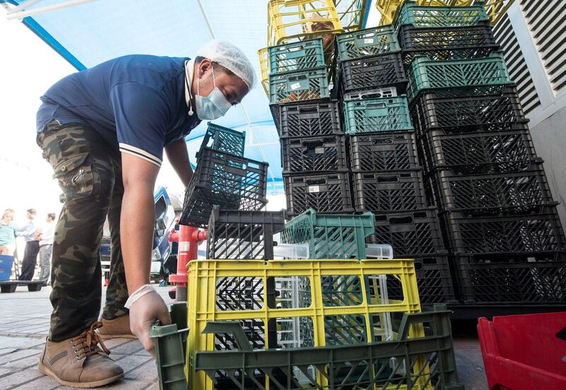 Dubai, United Arab Emirates - Workers separating plastic at the kibsons HQ, Dubai. Ruel Pableo for The National