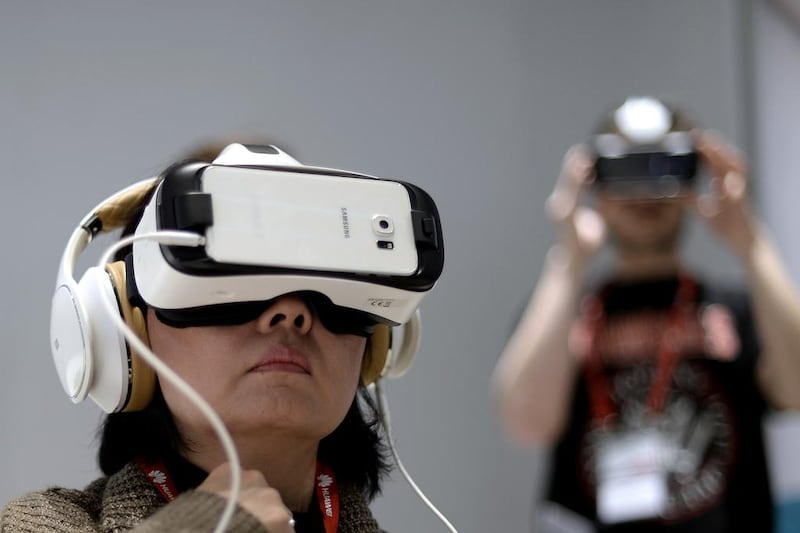 A woman uses Samsung Gear VR during the Mobile World Congress. Manu Fernandez / AP Photo