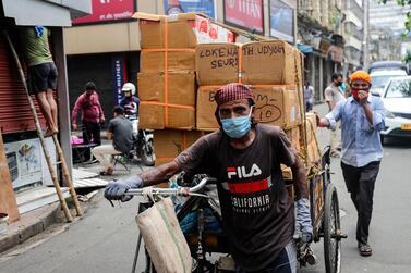 The Indian economy is reeling from a rise in Covid-19 infections - banks and major corporate borrowers in the country have turned to bond and equity markets this year to raise funds as they look to strengthen their capital base. AP Photo