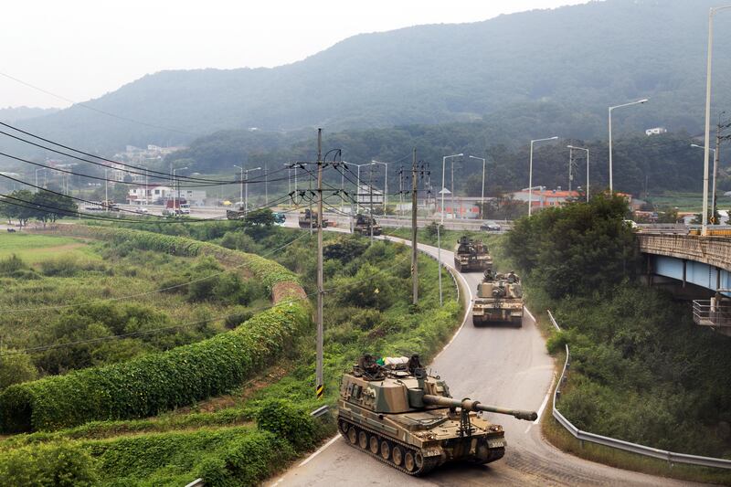 South Korean army tanks travel along a road near the border in Paju, South Korea, on Wednesday, Sept. 6, 2017. North Korean has been��seen readying another launch��of an intercontinental ballistic missile that could come before it marks the anniversary of its founding on Sept. 9.��Photographer: SeongJoon Cho/Bloomberg