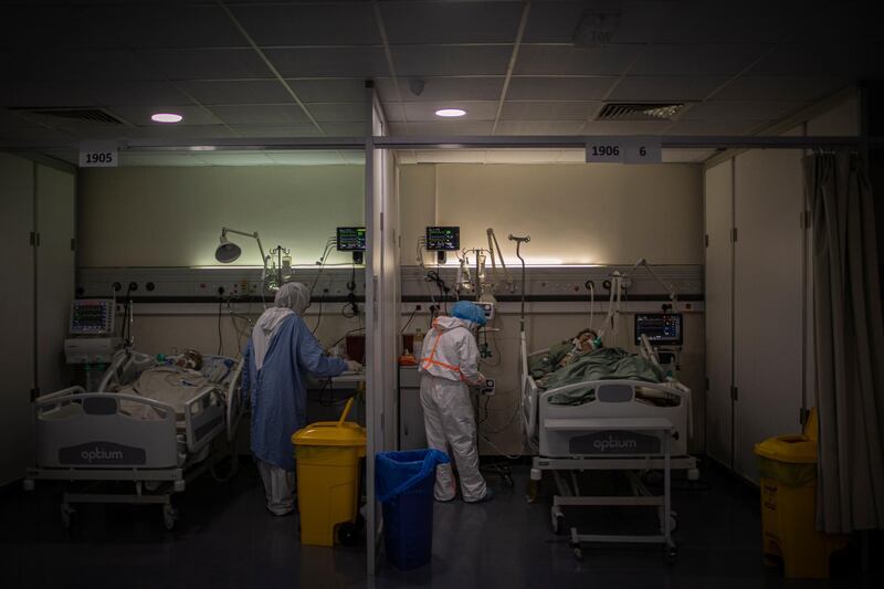 Lebanese nurses take care of COVID-19 patients inside the Intensive Care Unit of Rafik Hariri University Hospital. Getty Images