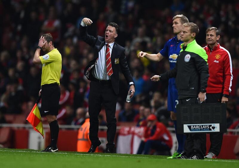 Louis van Gaal, centre, manager of Manchester United, gestures on the touchline during the Premier League match between Arsenal and Manchester United at Emirates Stadium on November 22, 2014 in London, England. Shaun Botterill/Getty Images