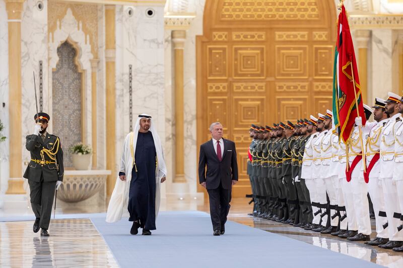 Sheikh Mohamed and King Abdullah inspect the honour guard in Abu Dhabi. Ryan Carter / UAE Presidential Court 