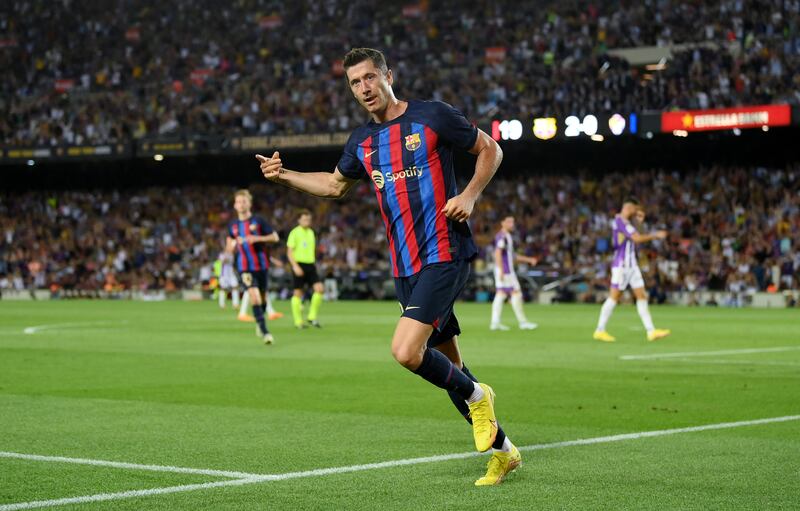 Robert Lewandowski celebrates after scoring Barcelona's third goal against Real Valladolid. Getty