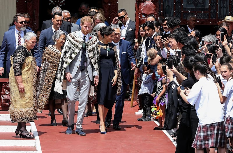 Prince Harry and Meghan depart the Tamatekapua meeting house on Te Papaiouru Marae in Rotorua. AFP