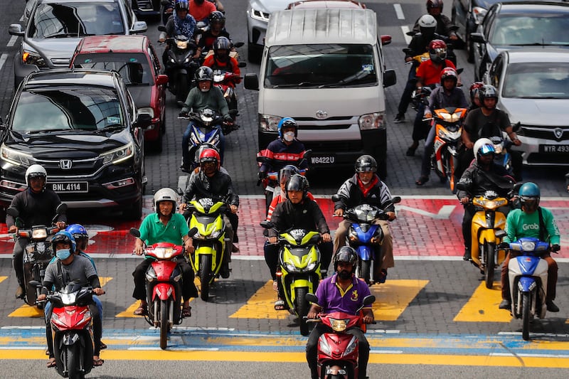 Motorists crowd a street in Kuala Lumpur.  EPA 