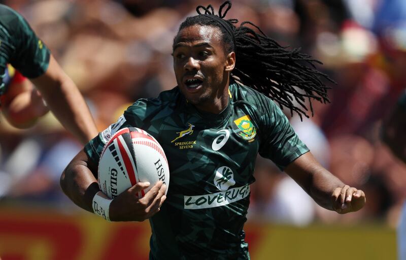 South Africa's Cecil Afrika runs in a try during the World Rugby Sevens Series match between South Africa and Scotland at Waikato Stadium in Hamilton on February 4, 2018. (Photo by MICHAEL BRADLEY / AFP)