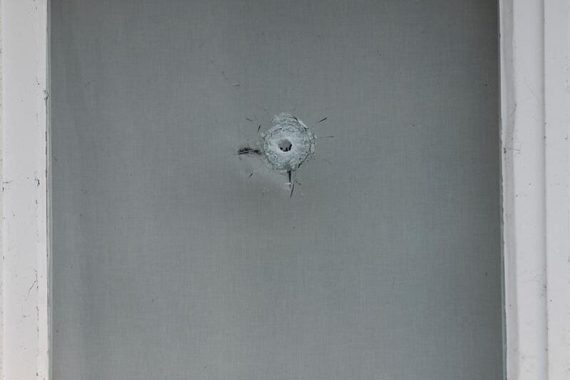 Bullet impacts are seen in the windows of Saudi Arabia's embassy in The Hague, Netherlands. AP