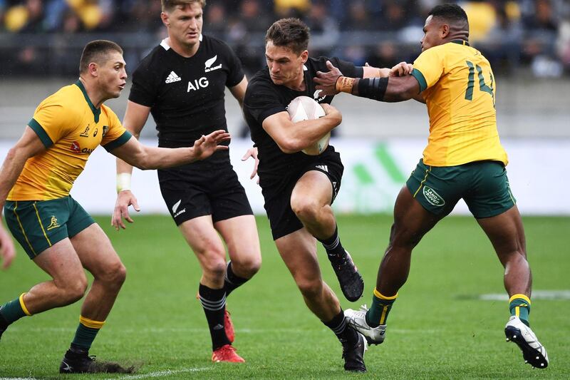 New Zealand's George Bridge runs between Australia's Filipo Daugunu, right, and James O'Connor, left, during the Bledisloe Cup rugby game between the All Blacks and the Wallabies in Wellington, New Zealand. AP Photo