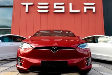 A service centre for Tesla cars in Amsterdam. A growth in electric car use is likely to dampen demand for oil by the late 2020s, the IEA's World Energy Outlook says. AFP