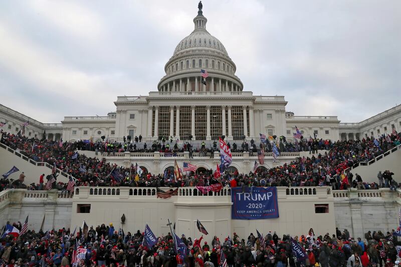 A mob of supporters of U.S. President Donald Trump storm the U.S. Capitol Building in Washington, U.S., January 6, 2021. Picture taken January 6, 2021. REUTERS/Leah Millis     TPX IMAGES OF THE DAY