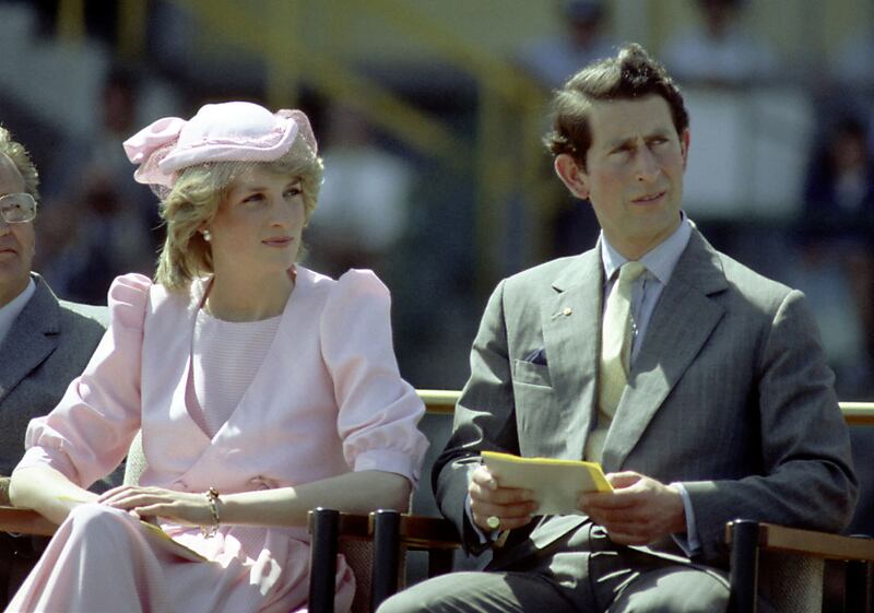 Princess Diana And Prince Charles watch an official event during their first royal Australian tour in 1983.