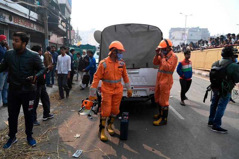 National Disaster Response Force personnel gear up as they prepare to access a factory site after a fire broke out, in Anaj Mandi area of New Delhi. At least 43 people have died in a factory fire in India's capital New Delhi.  AFP