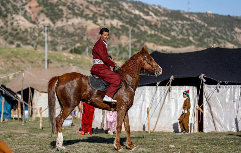 The typical outfit for a Kurdish man comprises a long-sleeved shirt, loose trousers and a vest tucked into a thick waistband. AFP