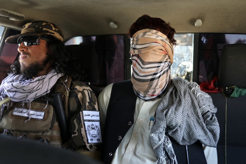 A suspected ISIS member sits blindfolded in a Taliban Special Forces' car in Kabul on September 5, 2021. Reuters
