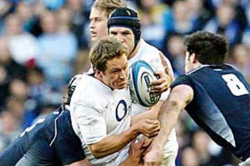 England's Jonny Wilkinson is tackled by the Scotland defence during this year's Six Nations campaign.