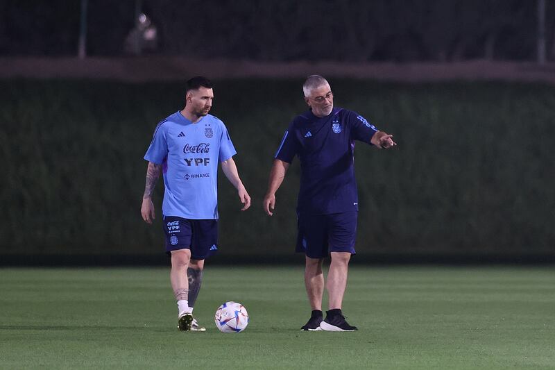 Argentina star Lionel Messi trains alone alongside medical officer Javier Hernandez at Qatar University on November 19, 2022 in Doha. Getty