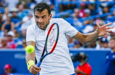 epa06153986 Grigor Dimitrov of Bulgaria in action against Nick Kyrgios of Australia the Western & Southern Open at the Linder Family Tennis Center in Mason, Ohio, USA, 20 August 2017. Dimitrov defeated Kyrgios in two sets.  EPA/TANNEN MAURY