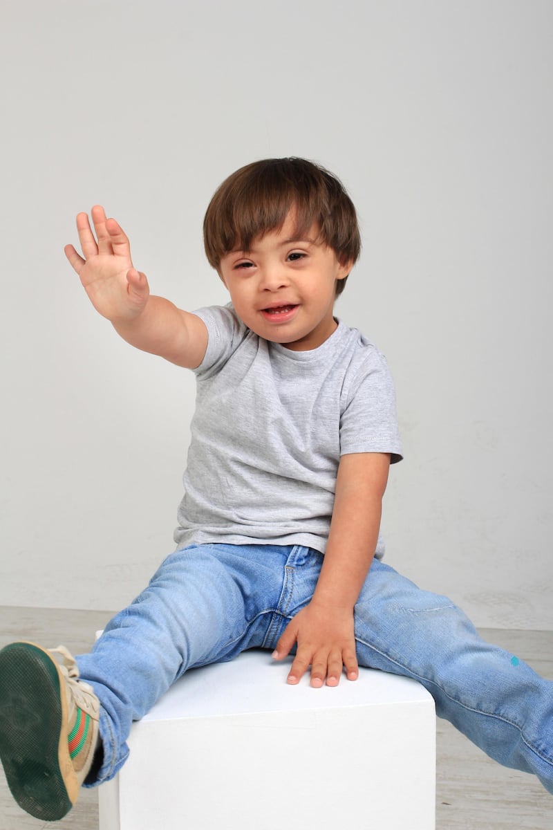 Three-year-old Emilio Said waves for the camera, as part of Bareface's new initiative. Courtesy Carl Vincent