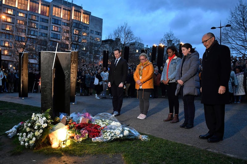 People take part in a vigil at the New Zealand War Memorial on Hyde Park Corner in London. AP