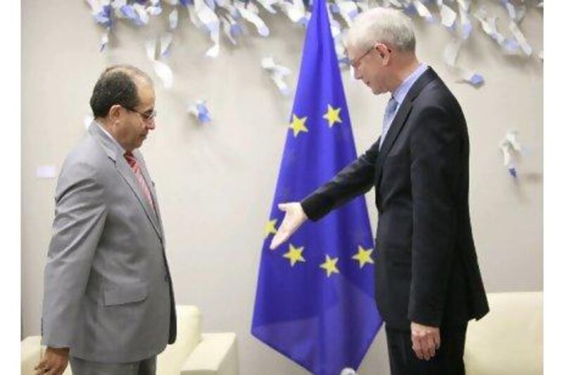 The chairman of the National Transitional Council of Libya, Mahmoud Jibril, left, is welcomed by the European Council president, Herman Van Rompuy, in Brussels yesterday. OLIVIER HOSLET / EPA