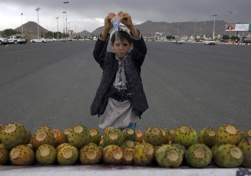A child sells prickly pear fruit on a street in Sanaa, Yemen. EPA