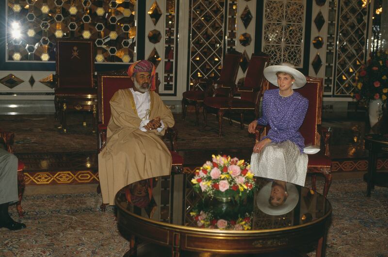 Diana, Princess of Wales, with Sultan Qaboos bin Said of Oman in Al Alam Palace, Muscat on November 11, 1986. She is wearing a suit by Catherine Walker and a Philip Somerville hat.