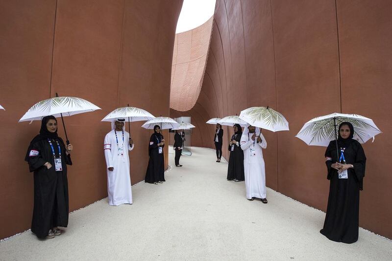Volunteers wait to receive visitors at the UAE pavilion at Expo 2015. (Giuseppe Aresu / The National)