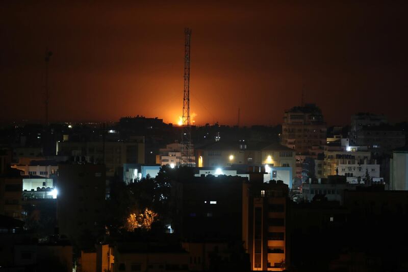 Flame and smoke are seen during an Israeli air strike in Gaza. Reuters