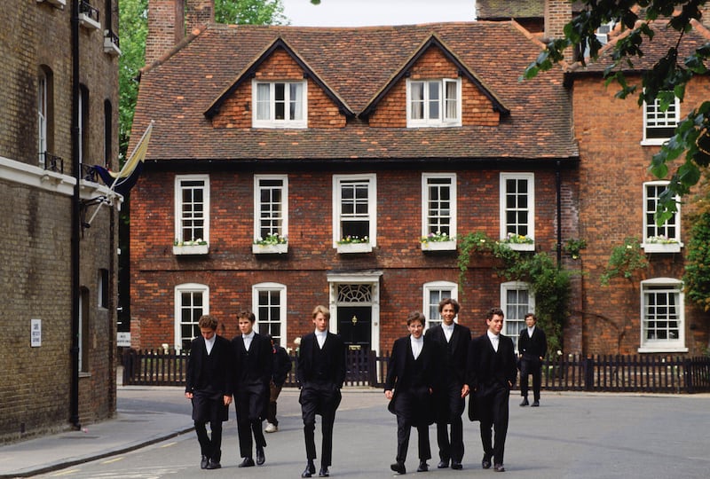 Schoolboys in traditional tailcoats at Eton College boarding school in Berkshire. Getty Images
