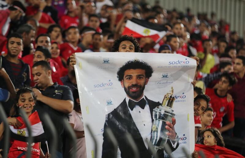 Soccer Football - African Nations Cup Qualifier - Egypt v Swaziland - Al-Salam Stadium, Cairo, Egypt - October 12, 2018  Fan holding a banner of Egypt's Mohamed Salah  REUTERS/Mohamed Abd El Ghany
