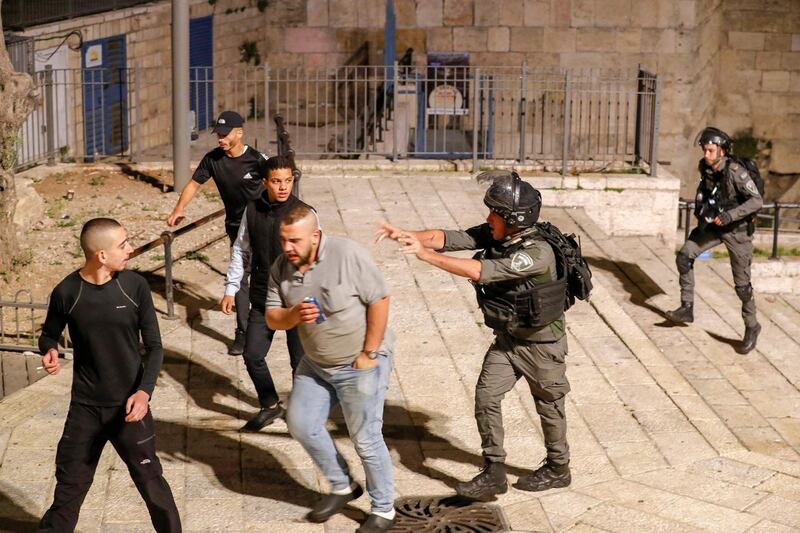 Israeli security forces disperse Palestinian protesters outside the Damascus Gate in Jerusalem's Old City, amid mounting tensions over a ban on gatherings and anger fueled by videos posted of attacks on youths.  AFP