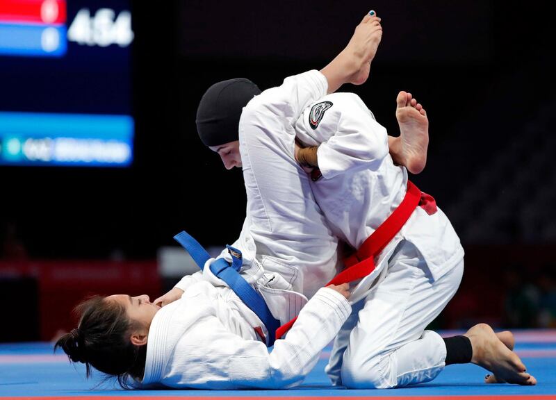 Jessa Khan of Cambodia and the UAE's Mahra Al Hanaei in action during the women’s 49kg final. Issei Kato / Reuters