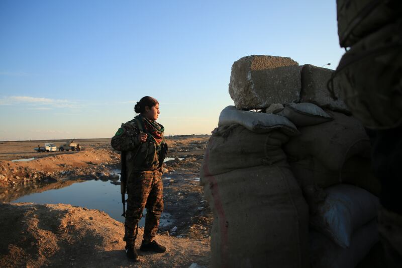 A soldier with the US-backed Syrian Democratic Forces stands guard in Hassakeh. AP