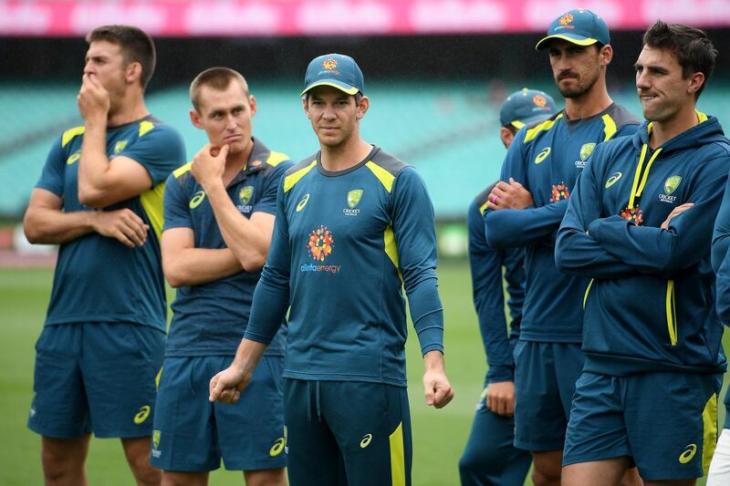 Australia's captain Tim Paine (C) watches on with teammates as India celebrates a 2-1 series victory following play being abandoned on day five in the fourth test match between Australia and India at the SCG in Sydney, Australia, January 7, 2019. AAP/Dan Himbrechts/via REUTERS  ATTENTION EDITORS - THIS IMAGE WAS PROVIDED BY A THIRD PARTY. NO RESALES. NO ARCHIVE. AUSTRALIA OUT. NEW ZEALAND OUT.