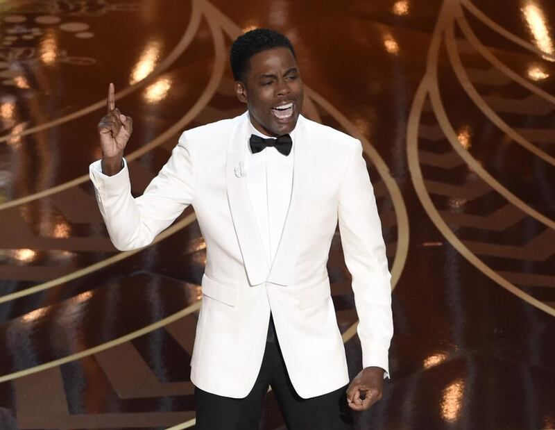 Chris Rock delivers his opening monologue at the Oscars in Los Angeles (Photo by Chris Pizzello/Invision/AP, File)
