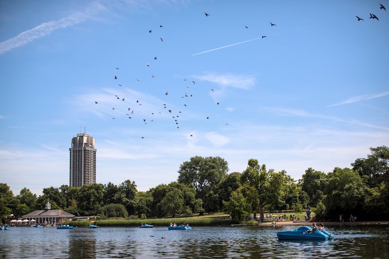LONDON, ENGLAND - JULY 17: Brids fly overhead as groups paddle on boats on the Serpentine in Hyde Park on July 17, 2017 in London, England. Much of Britain experienced warm and sunny weather today with a maximum temperature of 27 degrees celsius in London. (Photo by Jack Taylor/Getty Images)