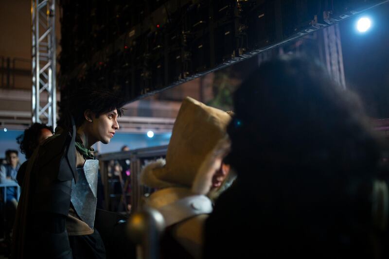 A contestant watches backstage during a costume competition at EgyCon, an annual convention for comics enthusiasts, in Cairo. AP Photo