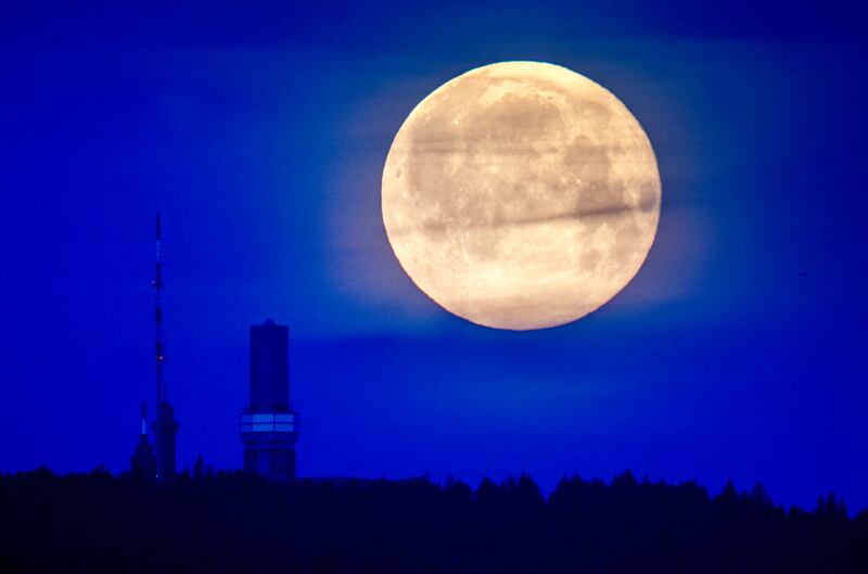 The Flower Moon is seen over the top of the Feldberg mountain in the Taunus range near Frankfurt, Germany, on May 6, 2023. AP