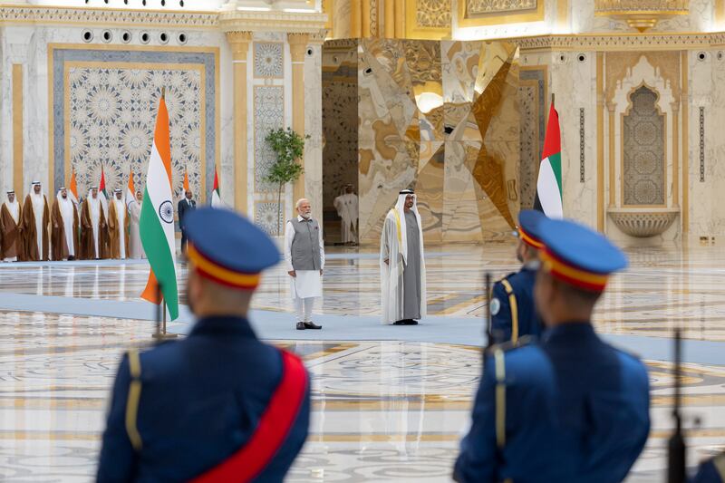 President Sheikh Mohamed and Narendra Modi, Prime Minister of India, stand for the national anthem at Qasr Al Watan.
Ryan Carter / UAE Presidential Court