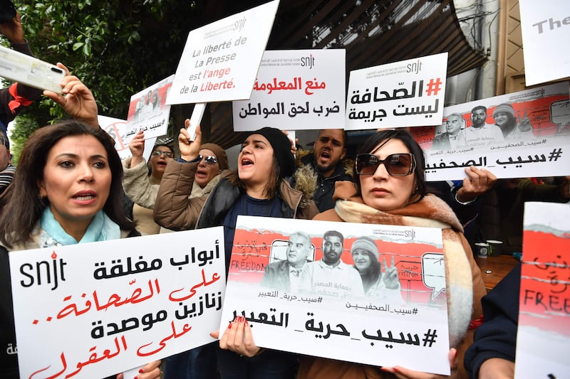 Tunisian journalists protest against the government and call for the release of their colleague Zied El Heni. AFP