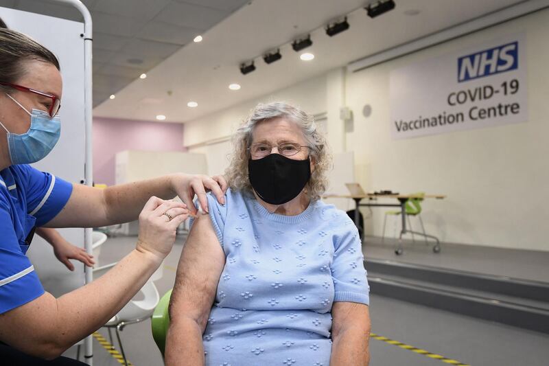 Margaret Austin, 87, receives an injection of a Covid-19 vaccine at a NHS mass coronavirus vaccination centre at Robertson House in Stevenage. Reuters