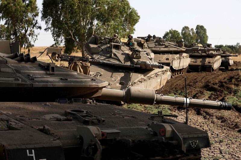 Israeli soldiers manoeuver Merkava tanks in the Israeli-annexed Golan Heights on June 2, 2019. / AFP / JALAA MAREY
