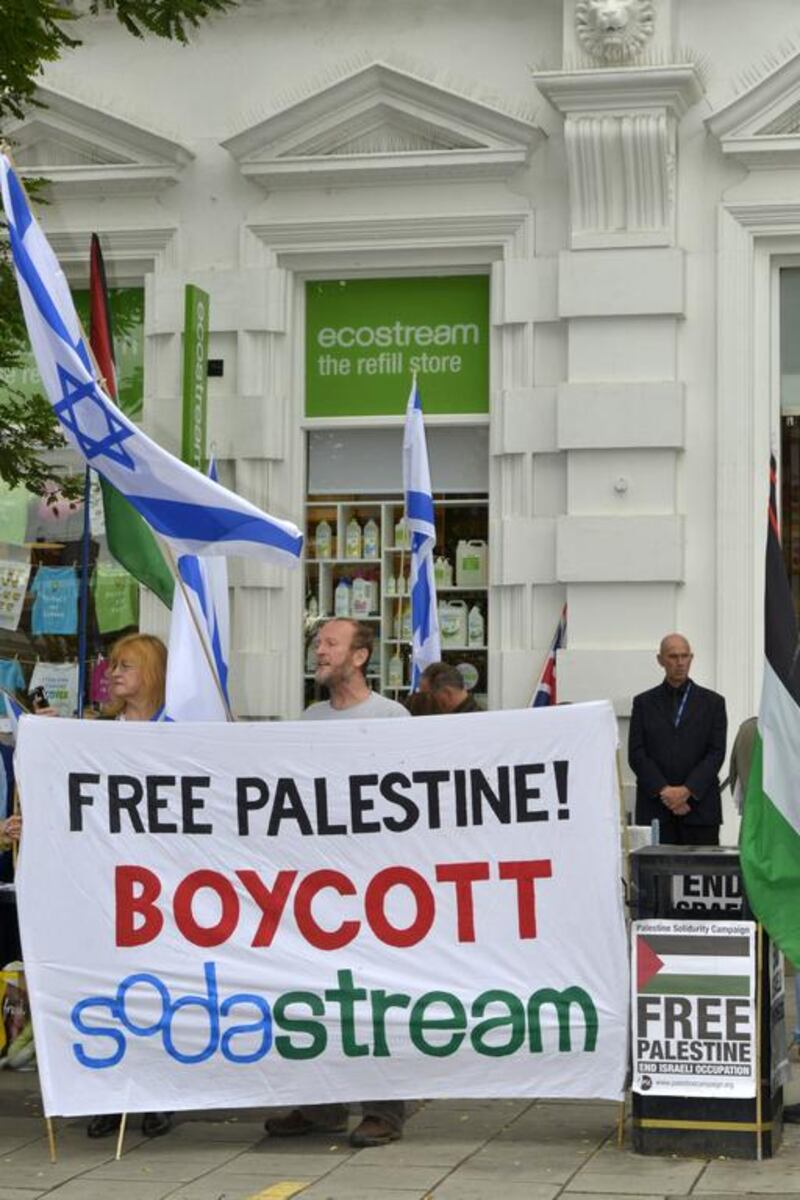 Pro-Palestine and pro-Israel protesters continue their year long demonstrations outside Ecostream, Western Road Brighton. Terry Applin for The National

