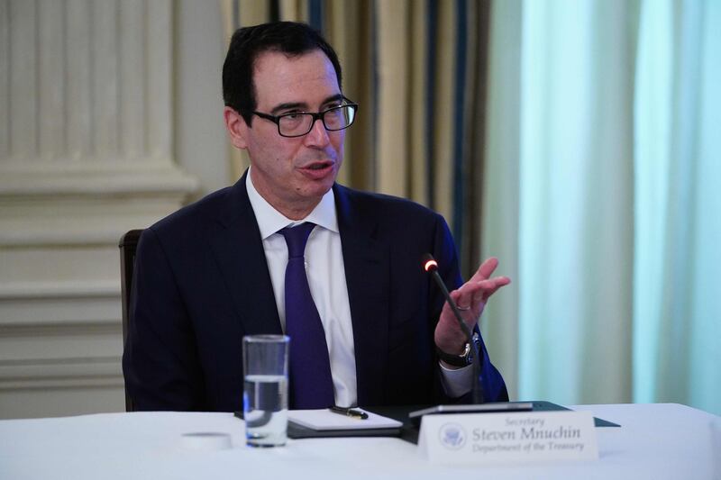 US Secretary of the Treasury Steve Mnuchin takes part in a roundtable discussion with US President Donald Trump and industry executives on reopening the country, in the State Dining Room of the White House in Washington, DC on May 29, 2020.


 / AFP / MANDEL NGAN
