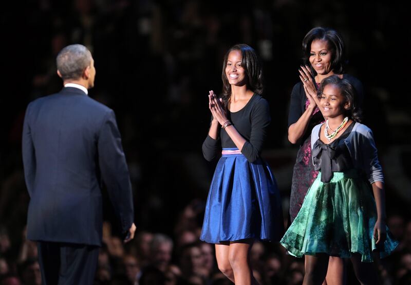 CHICAGO, IL - NOVEMBER 06: U.S. President Barack Obama stands on stage with first lady Michelle Obama and daughters Sasha and Malia after his victory speech on election night at McCormick Place November 6, 2012 in Chicago, Illinois. Obama won reelection against Republican candidate, former Massachusetts Governor Mitt Romney.   Spencer Platt/Getty Images/AFP== FOR NEWSPAPERS, INTERNET, TELCOS & TELEVISION USE ONLY ==
 *** Local Caption ***  838270-01-09.jpg