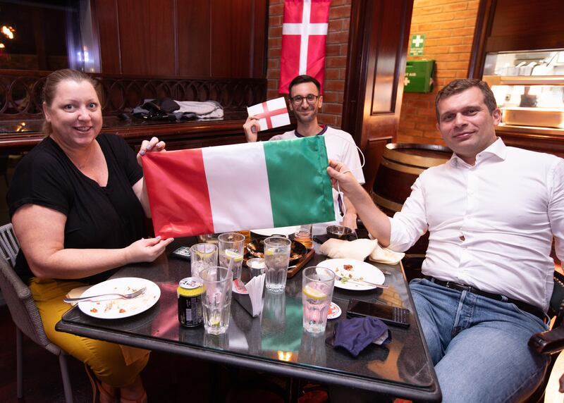 Italy fans Brandi Gribbin, Karim Mounib and Lorenzo Scrocca in Cooper’s Bar and Restaurant in Abu Dhabi ahead of the Euro 2020 final against Italy.