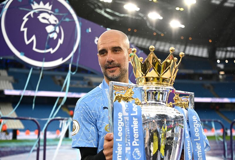 Pep Guardiola with the Premier League trophy on May 23, 2021. Getty