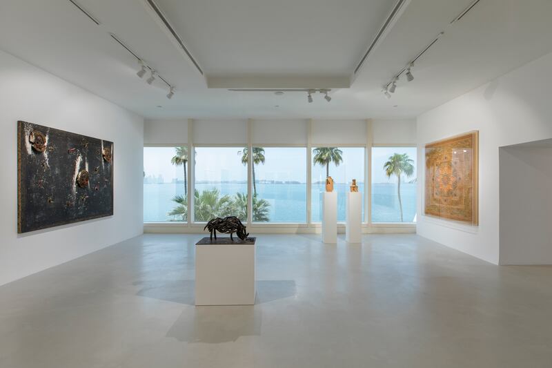 The new exhibition is inspired by Burj Al Arab's lavish interior designs and the element of fire. From left, 'Charcoal Mask' by Pascale Marthine Tayou; 'Creatura Africana' by Armando Testa; 'Ritrovarsi' by Ornaghi and Prestinari; and 'Arabesque' by Moataz Nasr.